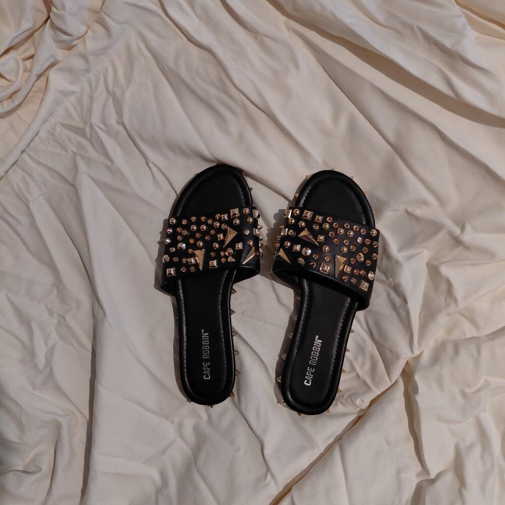 Black flats with spike embellishments
